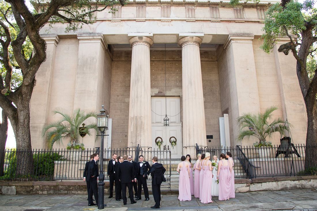 Wedding party outside a historic columned church