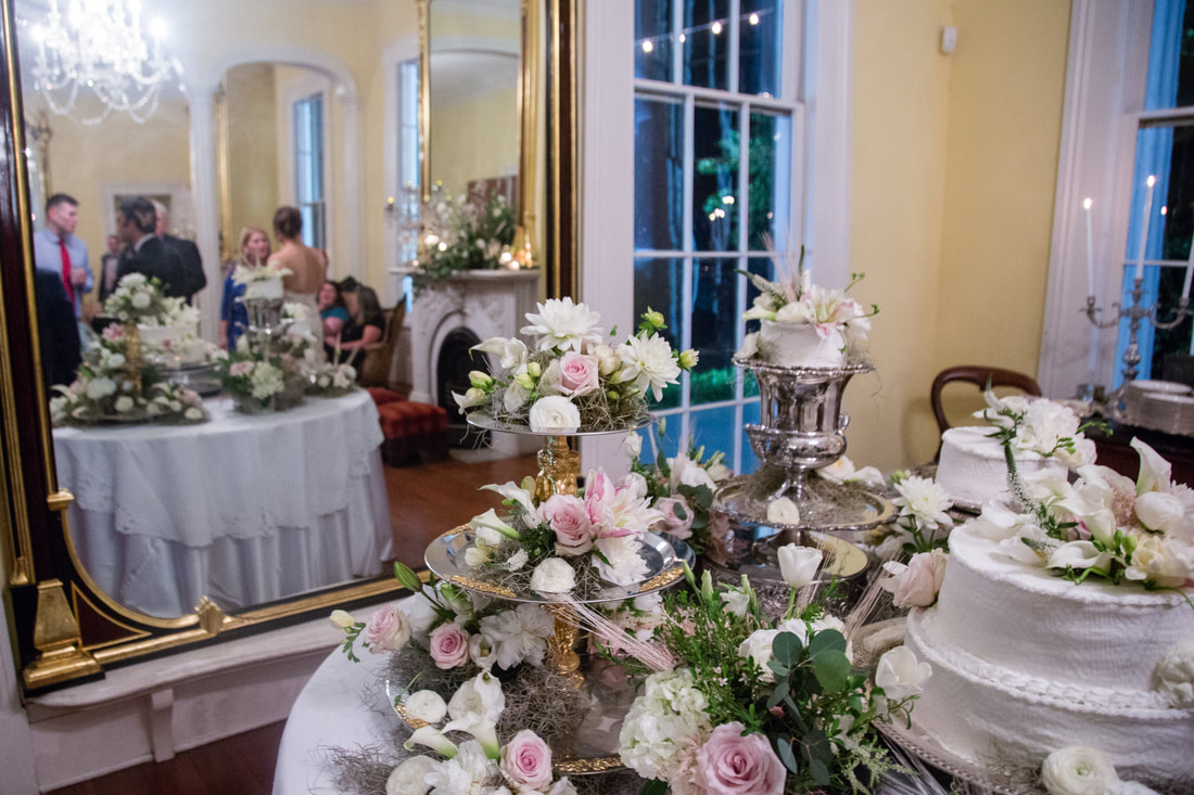 Wedding cake table with roses inside Bragg Mitchell Mansion