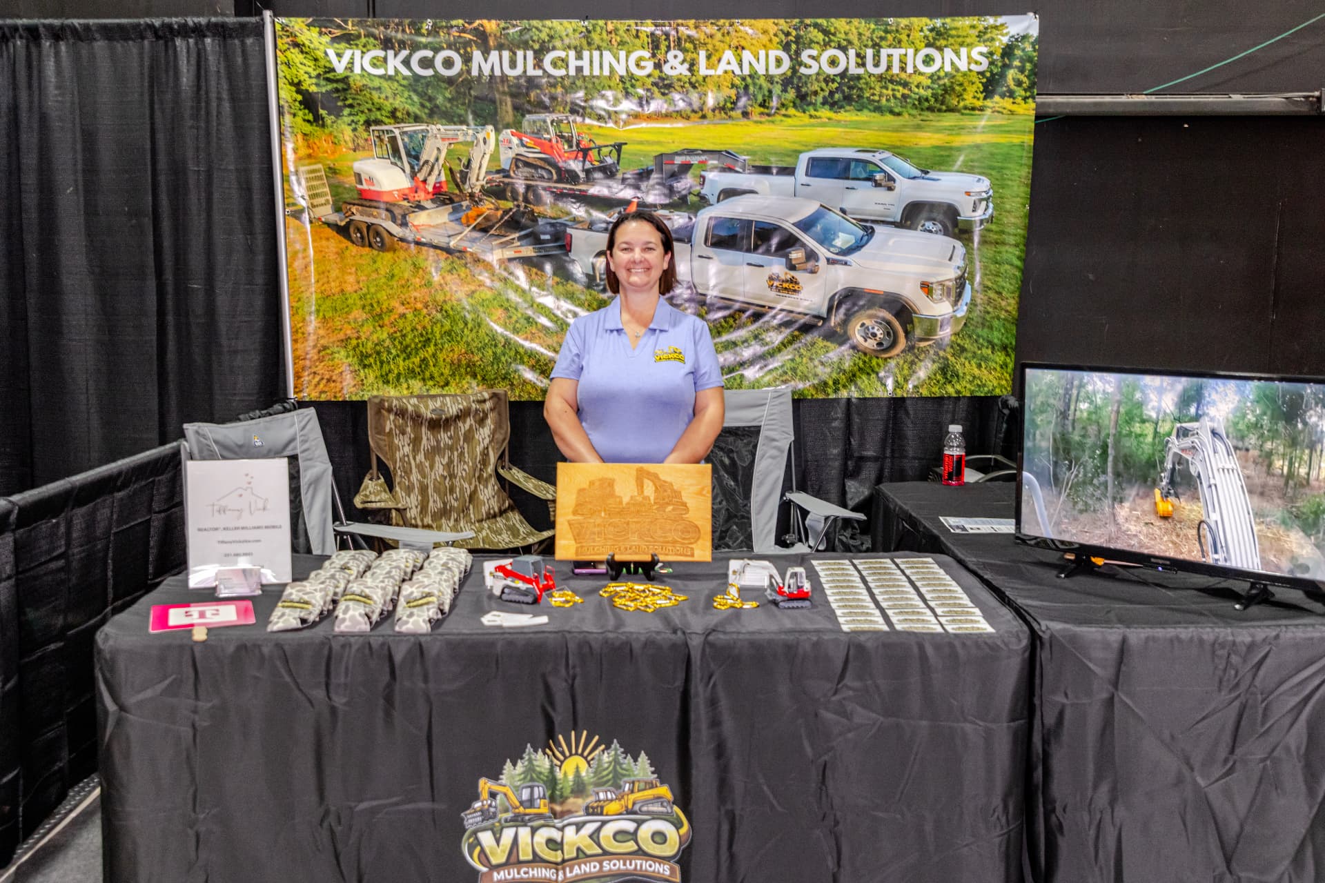 Exhibitor at her booth during the Mobile Home and Garden Show