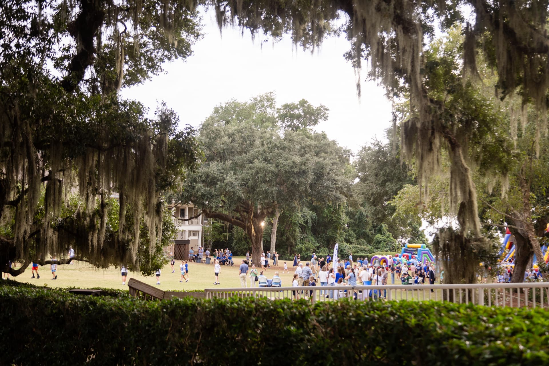 Bayside Academy field house and party lawn framed by mossy oaks