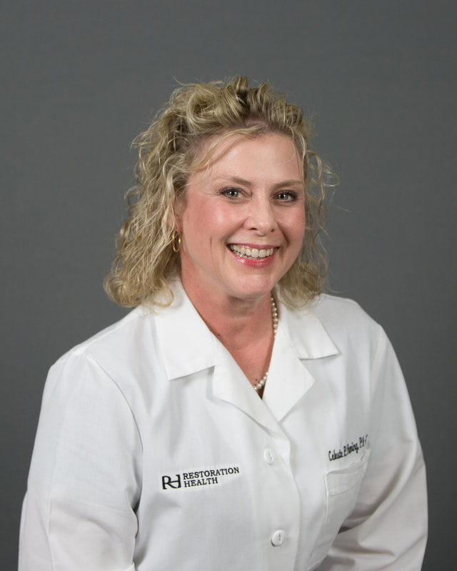 Restoration Health provider headshot on gray backdrop