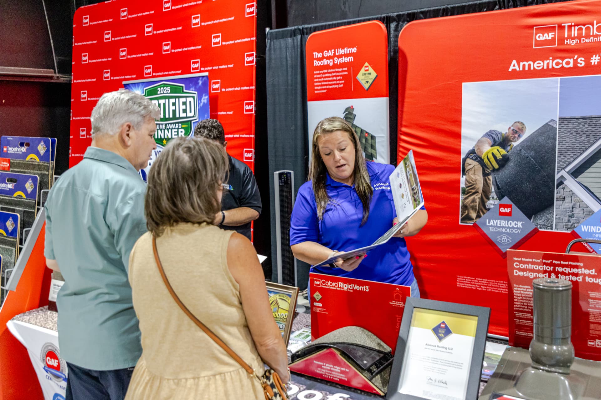 Vendor talking with guests at the Mobile Home and Garden Show