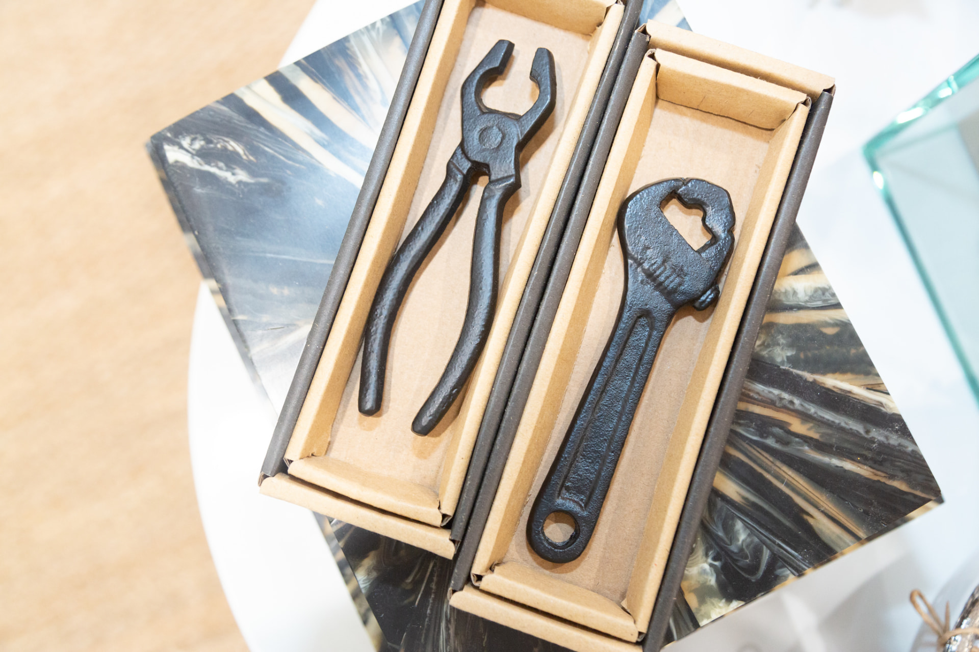 Cast iron bottle openers boxed as gift items in a boutique