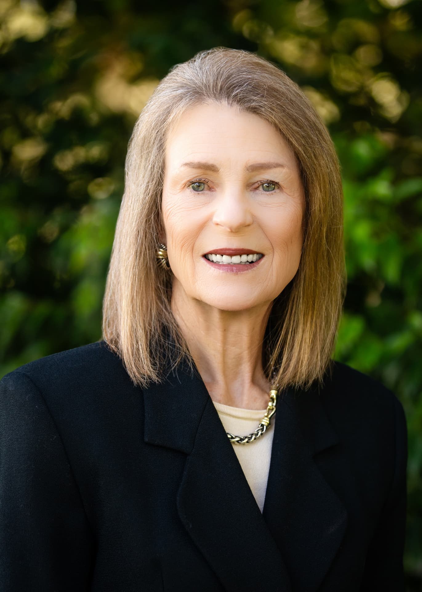 Realtor headshot photographed outdoors