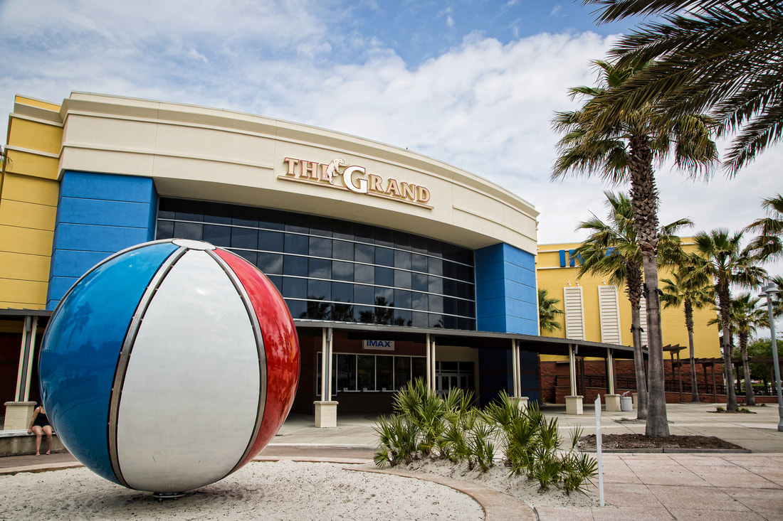 The Grand movie theatre exterior with palm trees
