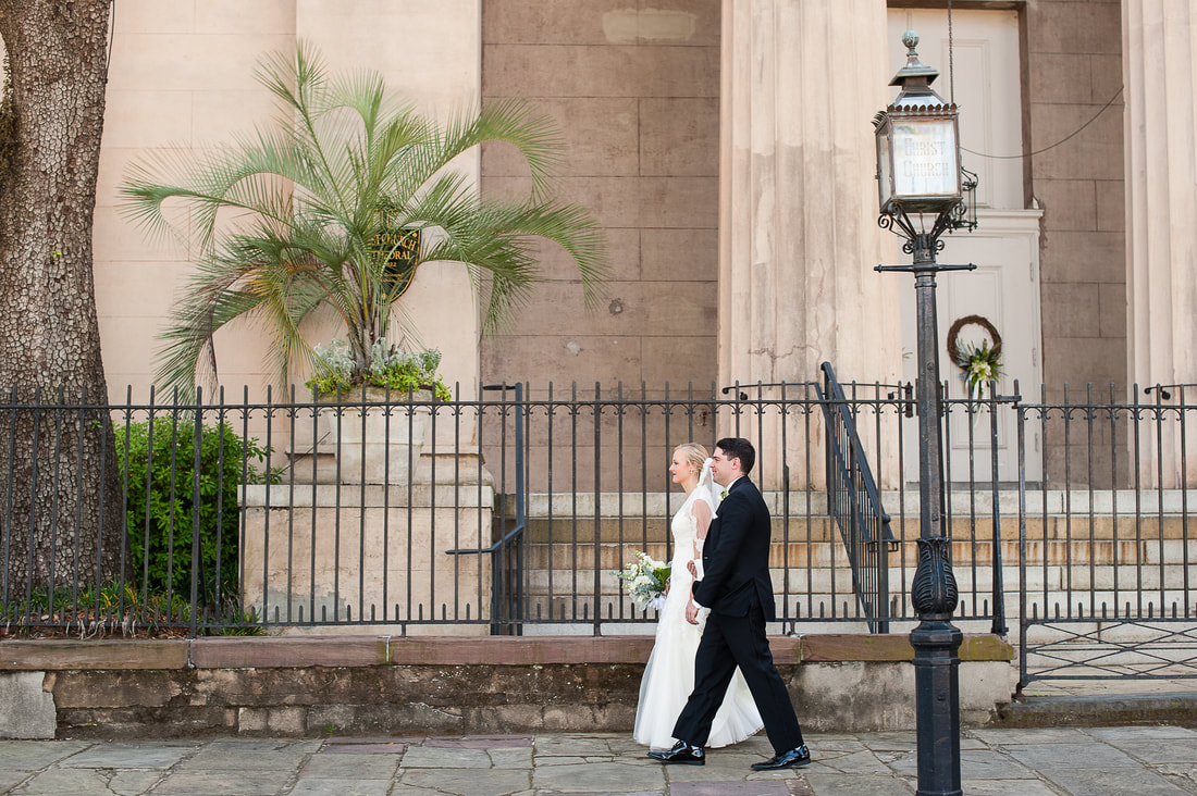 Bride and groom walking past Christ Church downtown