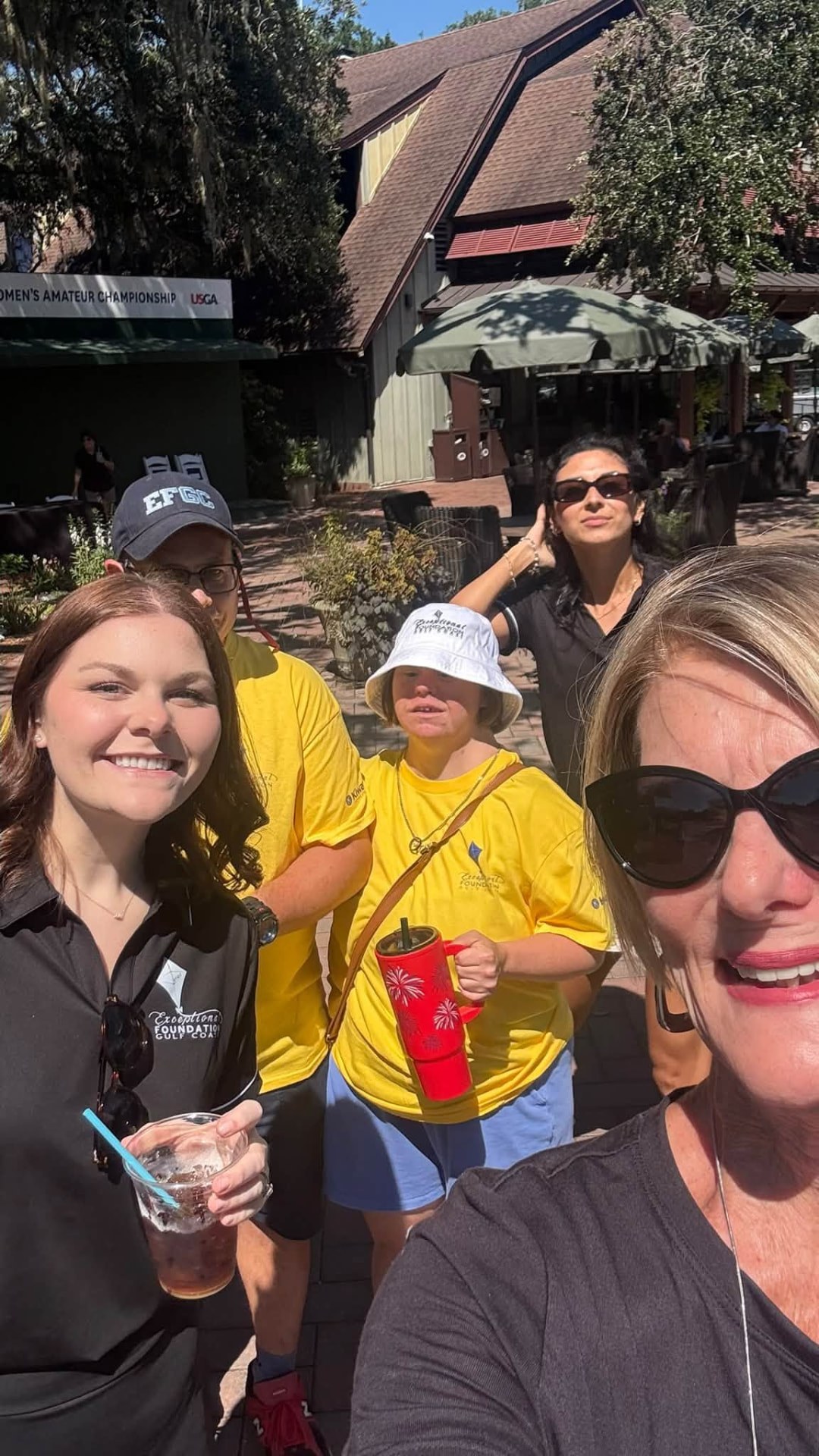 Cindy with volunteers at a golf tournament