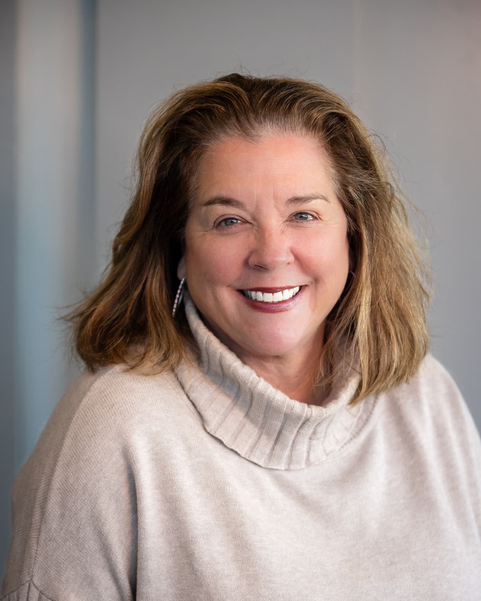 Chamber ambassador headshot in a cream sweater